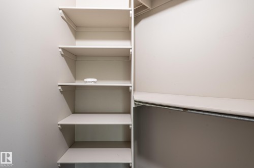 Built-in shelving and hanging rod offering ample storage capacity - 16811 91 Street, Edmonton, AB 