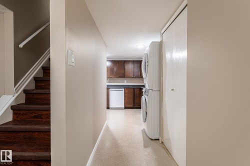 Finished wood-finish stairs with white handrail - 16811 91 Street, Edmonton, AB 