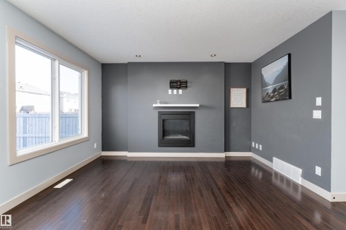 152 Radcliffe Wynd, Fort Saskatchewan, AB - Indoor Photo Showing Other Room With Fireplace