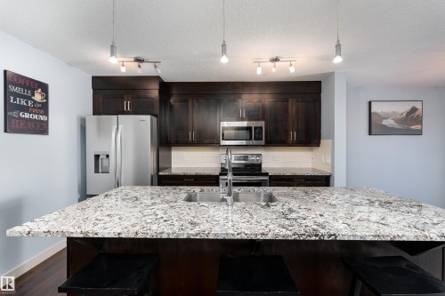 152 Radcliffe Wynd, Fort Saskatchewan, AB - Indoor Photo Showing Kitchen With Stainless Steel Kitchen With Double Sink With Upgraded Kitchen