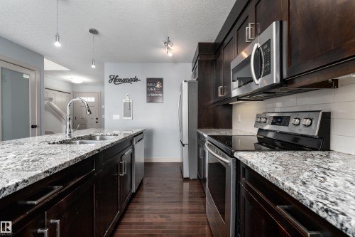 152 Radcliffe Wynd, Fort Saskatchewan, AB - Indoor Photo Showing Kitchen With Stainless Steel Kitchen With Double Sink With Upgraded Kitchen