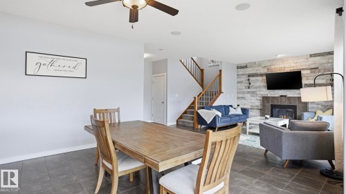 75 Rue Moreau, Beaumont, AB - Indoor Photo Showing Dining Room With Fireplace