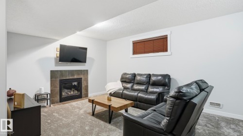 75 Rue Moreau, Beaumont, AB - Indoor Photo Showing Living Room With Fireplace