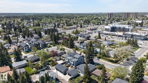 Aerial perspective showcasing a residential area with mature trees - 8809 148 Street, Edmonton, AB - Outdoor With View