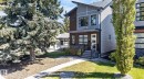 Modern exterior featuring multi-toned siding, stone accents, black-framed windows, a covered entrance, and a landscaped front yard with mature trees - 8809 148 Street, Edmonton, AB  - Outdoor With Facade 