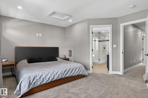 Carpeted bedroom with recessed lighting and a ceiling-mounted skylight - 8809 148 Street, Edmonton, AB - Indoor Photo Showing Bedroom