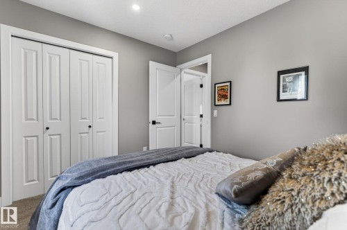 Neutral gray wall paint complementing white trim and interior doors - 8809 148 Street, Edmonton, AB - Indoor Photo Showing Bedroom
