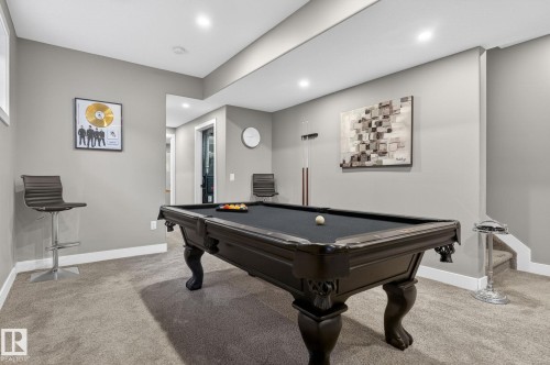 Recreational room featuring a dark-toned billiard table with a black felt surface, recessed lighting, and light gray wall paint - 8809 148 Street, Edmonton, AB - Indoor Photo Showing Other Room