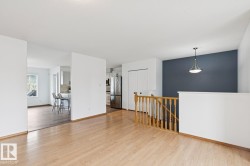 Hardwood-finish flooring extending through an open living area - 