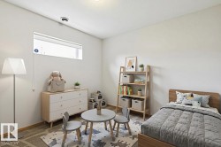 Bright room featuring a horizontal window, white walls, and wood-finish flooring - 