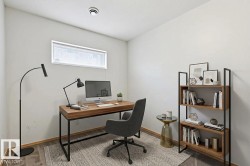 Versatile room featuring a horizontal window, recessed ceiling light, and wood-finish flooring - 