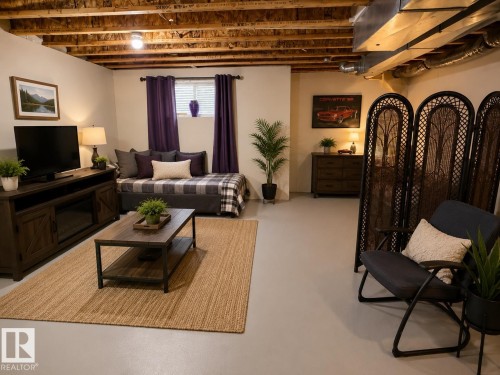 Finished basement space featuring exposed ceiling joists and ductwork - 102 Hartwick Loop, Spruce Grove, AB 