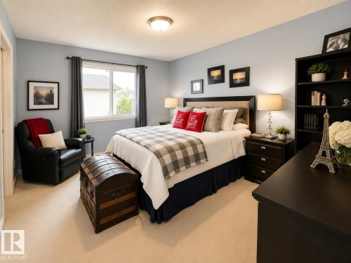 Carpeted bedroom featuring a large window, neutral wall paint, built-in shelving, and a prominent dark wood headboard - 102 Hartwick Loop, Spruce Grove, AB 