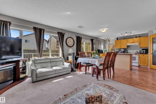 Open-concept living area with large windows - 14031 136 Street, Edmonton, AB 