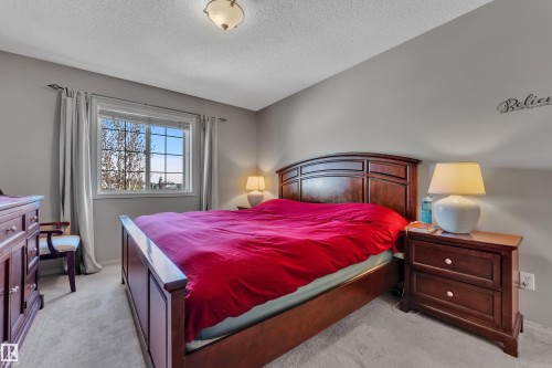 Bedroom featuring neutral wall paint and light-colored carpeting - 14031 136 Street, Edmonton, AB 