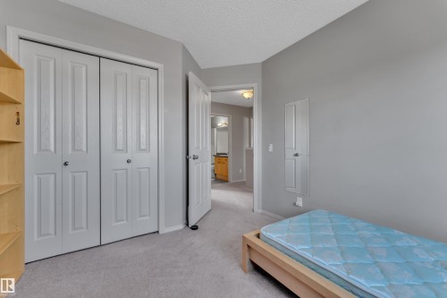 Bedroom with neutral gray walls and light gray carpet - 14031 136 Street, Edmonton, AB 