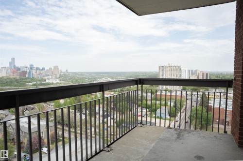 Private balcony with a concrete floor, black metal railings, and a brick exterior wall - 1703 11027 87 Avenue N, Edmonton, AB - Outdoor With Balcony With Exterior