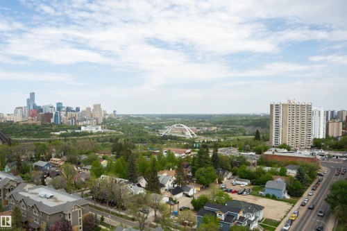 Expansive urban skyline featuring a variety of high-rise buildings and a prominent arched bridge over a tree-lined river valley - 1703 11027 87 Avenue N, Edmonton, AB - Outdoor With View