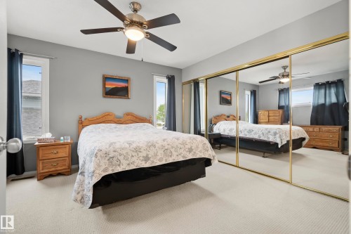 Expansive mirrored closet doors with gold-tone framing - 15503 62 Street, Edmonton, AB 