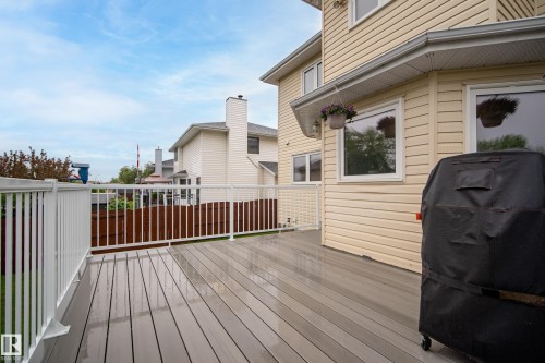 Spacious outdoor deck featuring composite flooring and white railings - 15503 62 Street, Edmonton, AB 