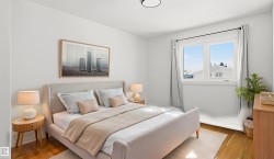 Bright bedroom featuring wood-finish flooring, a large window, white walls, and a contemporary ceiling light fixture - 