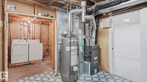 Utility area featuring a water heater, furnace, and exposed ductwork - 20C Callingwood Court, Edmonton, AB - Indoor