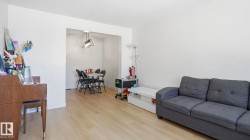 Open-concept living area with light wood-finish flooring - 