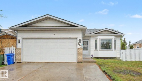 Ranch-style residence featuring a two-car garage with a concrete driveway - 242 Northmount Drive, Wetaskiwin, AB 