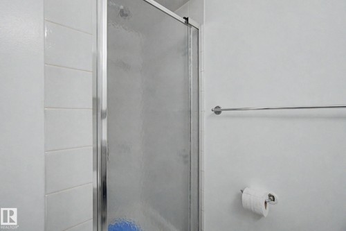 Shower enclosure with frosted glass panel and chrome frame - 242 Northmount Drive, Wetaskiwin, AB 