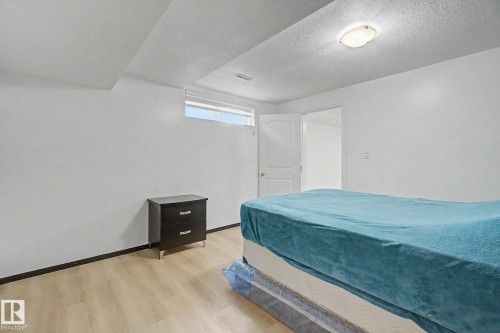 Room featuring light wood-finish flooring and white walls - 242 Northmount Drive, Wetaskiwin, AB 