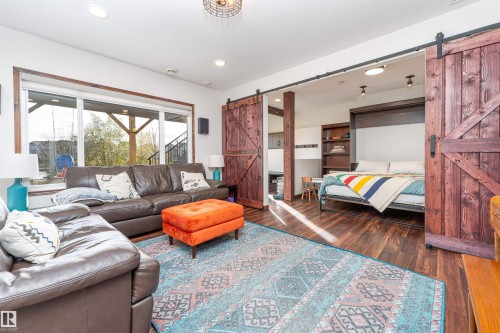 Barn doors that showcase a flex space for extra sleeping area. - 3318 Parker Loop, Edmonton, AB - Indoor