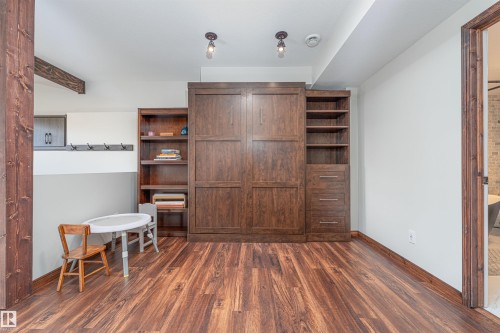 Murphy bed away shows extra living space - 3318 Parker Loop, Edmonton, AB - Indoor Photo Showing Other Room
