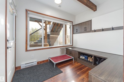 Walk out to beautiful lower deck - 3318 Parker Loop, Edmonton, AB - Indoor Photo Showing Other Room With Fireplace