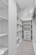 Custom closet system featuring extensive shelving - 