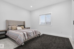 Room featuring recessed lighting, a white window frame with horizontal blinds, and baseboard trim - 