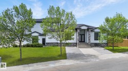 Contemporary exterior with white siding and dark trim - 