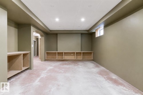Spacious room with recessed lighting and neutral wall tones - 703 107A Street, Edmonton, AB 