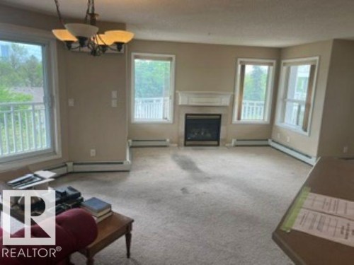 415 10951 124 Street, Edmonton, AB - Indoor Photo Showing Living Room With Fireplace