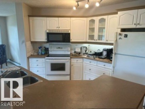 415 10951 124 Street, Edmonton, AB - Indoor Photo Showing Kitchen With Double Sink