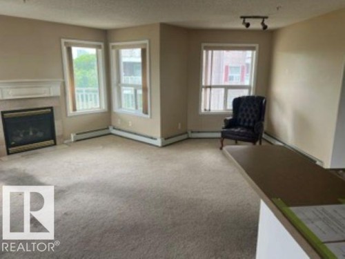 415 10951 124 Street, Edmonton, AB - Indoor With Fireplace