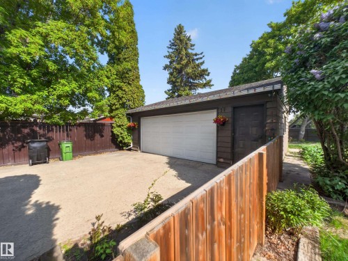 Detached garage with a white overhead door and side access door - 18416 90 Avenue, Edmonton, AB 