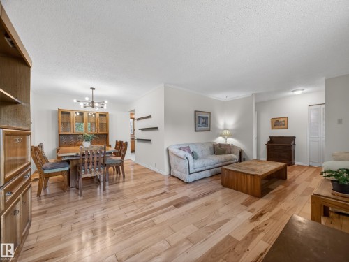 Open-concept living area with wood-finish flooring - 18416 90 Avenue, Edmonton, AB 