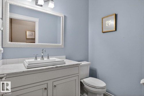 Main Floor 2 Piece Bath featuring Vanity with Raised Sink - 5016 213 Street, Edmonton, AB 