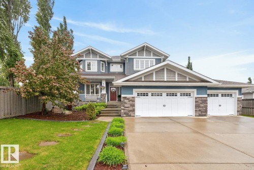 Stunning 2 Storey Home located at Copperwood in the Hamptons featuring Front Porch, Triple Car Garage, and Oversized Driveway in a quiet cul de sac and siding on to a Walking Path. - 5016 213 Street, Edmonton, AB 