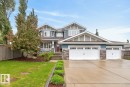 Stunning 2 Storey Home located at Copperwood in the Hamptons featuring Front Porch, Triple Car Garage, and Oversized Driveway in a quiet cul de sac and siding on to a Walking Path. - 5016 213 Street, Edmonton, AB 
