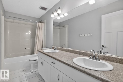 4 Piece Bathroom featuring Tub/Shower, and Double Vanity with plenty of storage space - 5016 213 Street, Edmonton, AB 