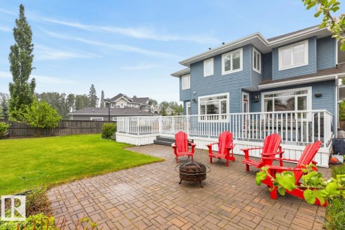 Large South Facing Backyard Space (1259 m@ / 0.31 Acres) featuring Apple Trees, Pear Trees, Cherry Trees, Berry Bushes, Irrigation System, Fire Pit, and Fountain - 5016 213 Street, Edmonton, AB 