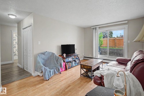 009 10520 80 Avenue, Edmonton, AB - Indoor Photo Showing Living Room