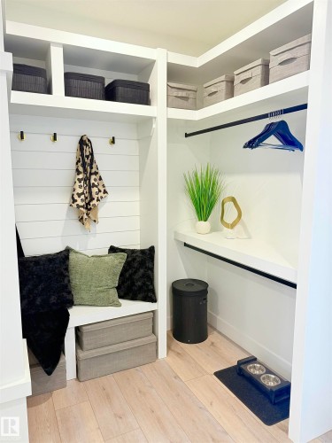 Built-in storage solutions featuring light wood-finish flooring - 16607 8 Street, Edmonton, AB 