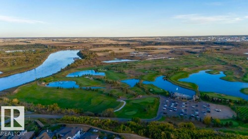 Expansive golf course setting featuring multiple water features, manicured greens, and mature tree lines - 16607 8 Street, Edmonton, AB 